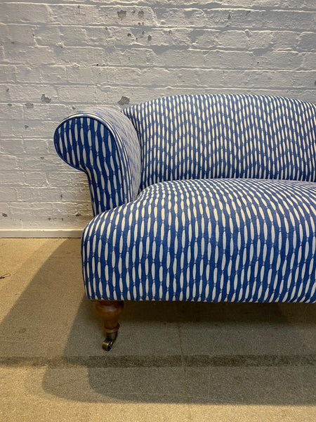 Bespoke loveseat in Linwood Smocked on castor legs