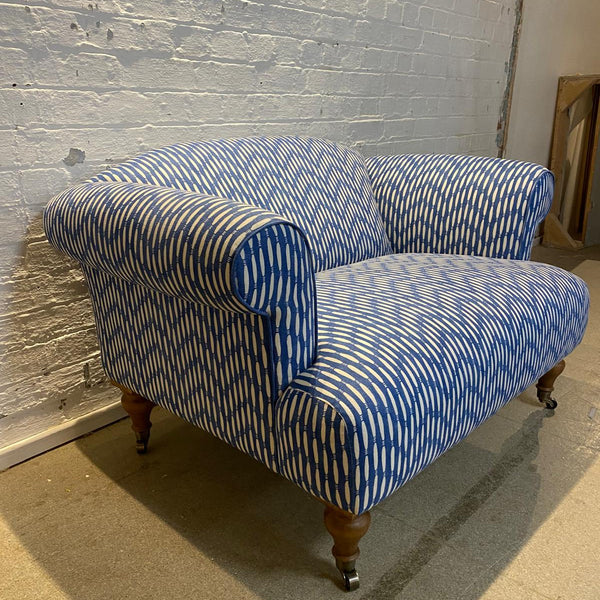 Bespoke loveseat in Linwood Smocked on castor legs