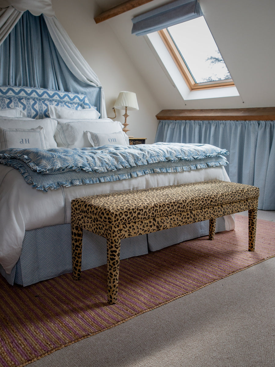 The Aria - upholstered in Claremont Bon Marche leopard print and used as an end of bed bench