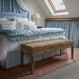 The Aria - upholstered in Claremont Bon Marche leopard print and used as an end of bed bench