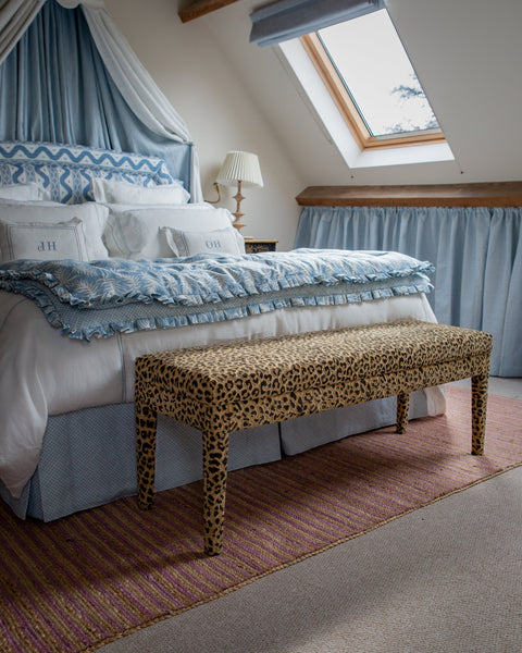 The Aria - upholstered in Claremont Bon Marche leopard print and used as an end of bed bench