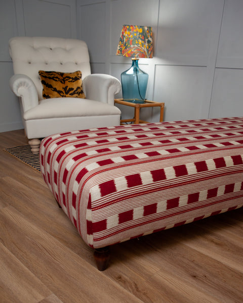 An example of this piece in Red Christopher Farr Lost & Found fabric