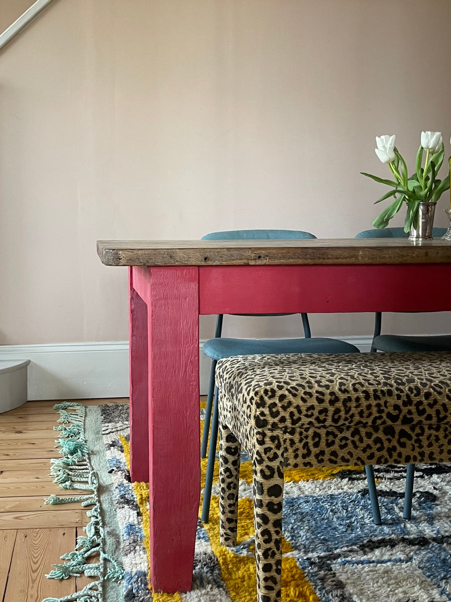 An Aria in Claremont Bon Marche Leopard print used as a dining bench