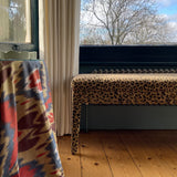 An Aria bench in Claremont Bon Marche Leopard print used as a window seat