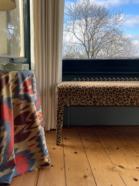 An Aria bench in Claremont Bon Marche Leopard print used as a window seat